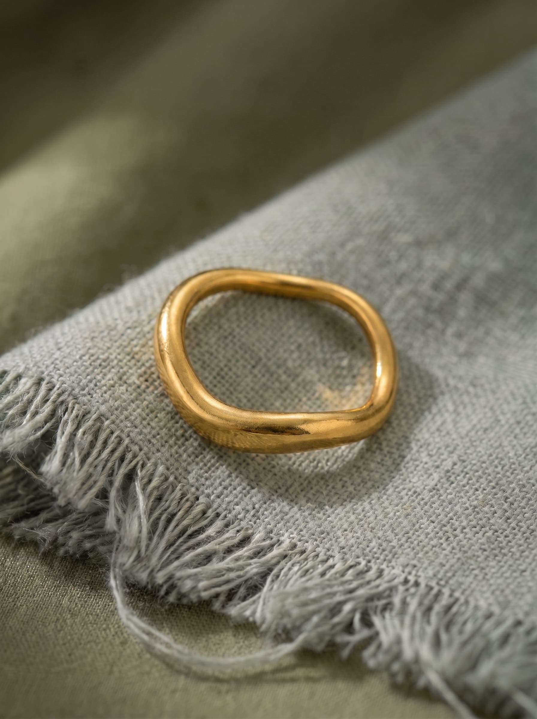 Wave Ring on grey linen